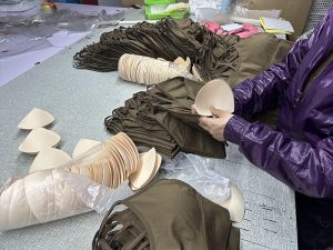 shapewear professionals assembling finished product displays